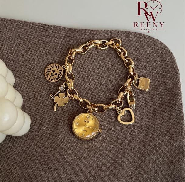 Gold charm bracelet watch